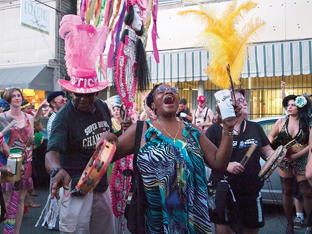 The Skinz and Bonez gang chants their way down Oak Street. 