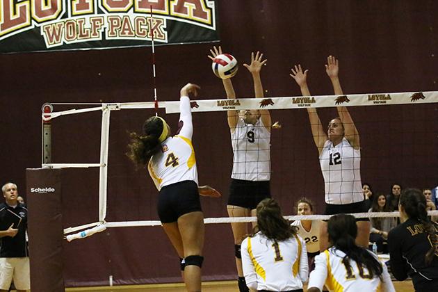 Eva Allen, a mass communications junior, blocks the ball against