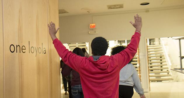 Protestors march through the Danna Student Center at Loyola.