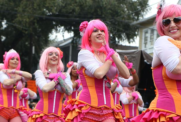 The Pussyfooters dance troupe strut down St. Charles Avenue during the 2014 Krewe of Carrollton.  All female krewes and marching groups historically make up a significant portion of Mardi Gras celebrations. 