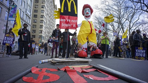 Protesters gathered in New York to join in the nationwide protests occuring on Wednesday, April 15 to call for an increase of minimum wage to $15 per hour.