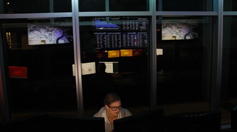 Rachel Shields, international business senior, works in Loyola’s Carlos M. Ayala Stock Trading Room.  Loyola recently announced a new major and minor in business analytics within the College of Business, to be launched in the fall of 2015.  The program will teach students how to manage and analyze data and databases and create mathematical models for business decisions, among other business leadership and data skills.