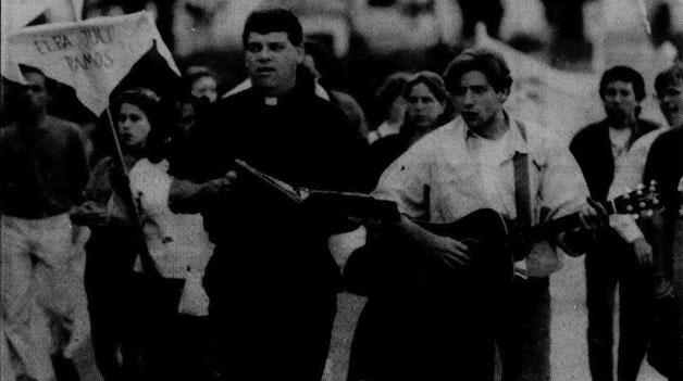 Members of the Loyola community, Fr. Tom Hidding and Doug Gleber, protest in downtown New Orleans on the anniversary of the murders in El Salvador in 1990. Although El Salvador is physically far away, Loyola still felt the effects of these murders. 