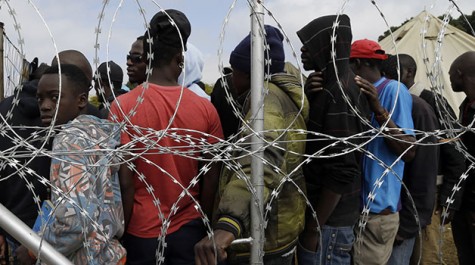 Immigrants to Johannesburg, South Africa wait in line for food at a refugee camp on Monday, April 20. Attacks on immigrants over the past week have resulted in the deaths of seven people.