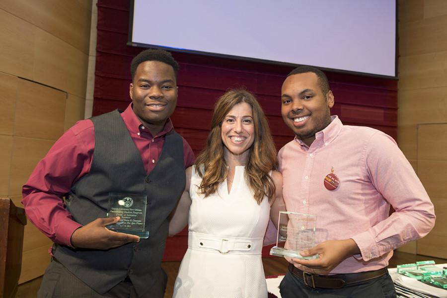 Shawn Kelly (left), president of the Commuter Student Association and sociology sophomore, and Mathew Holloway (right), president of the Black Student Union and sociology junior, receive the Outstanding Student Program award from Heather Seaman (middle), director of co-curricular programs, at the Magis Awards on April 28. They received this award for their  “Our Lives Matter”  program last semester.