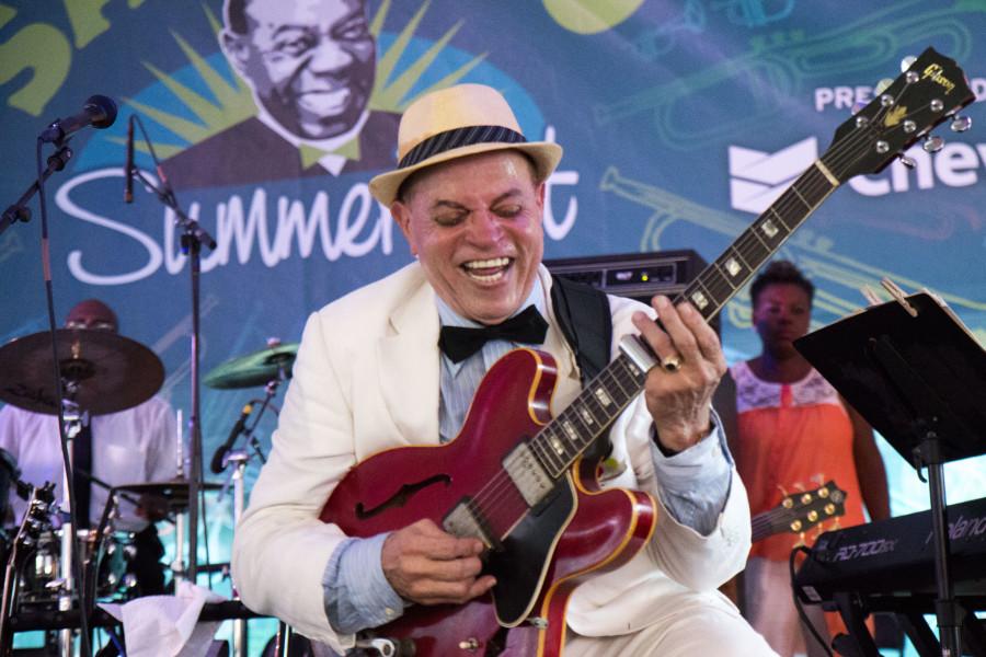 Deacon John Moore plays his guitar at the 15th annual Satchmo Summer Festival at the Old U.S. Mint. The festival celebrates the music and legacy of trumpeter Louis Armstrong. Photo credit: Zach Brien