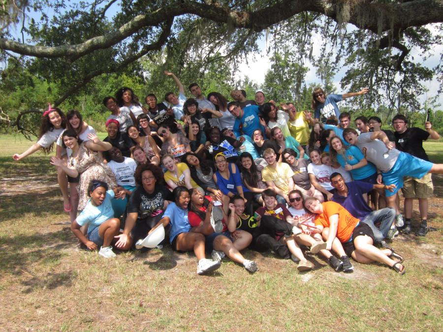 Freshmen and seniors from last years first-year retreat pose for a photo at the Fountainbleau State Park. This year, the retreat will be held at the same location.