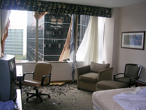 His hotel room window, made of crystal glass, exploded after the storm made landfall with 127 mph winds.