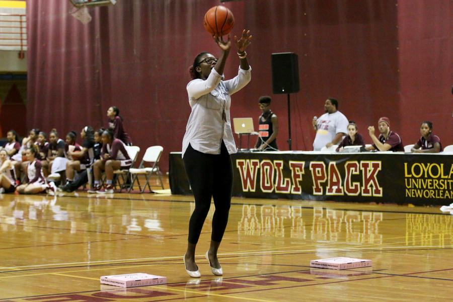 Nat Mitchell, a freshmen pre-health psychology major, shoots a free throw in one of two crowd participation activities at Fan Fest on Thursday in the Den. The event featured scrimmages by the mens and womens basketball teams, a three point competition and crowd activities.