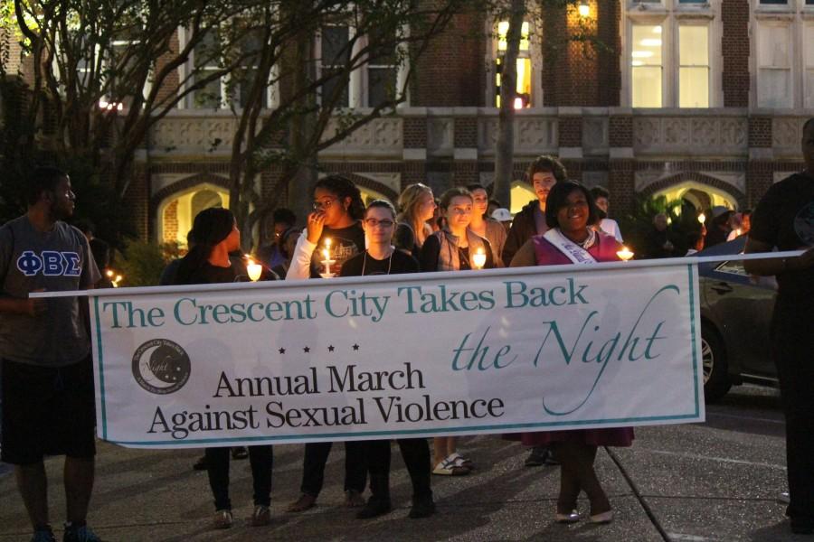 Students prepare to march at Take Back the Night in the horseshoe. The event brings together students from Loyola, Tulane, Xavier and Dillard to call attention to sexual assault. Photo credit: Kristen Stewart