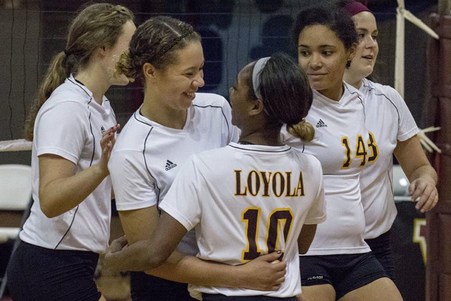 Eva Allen, mass communication senior, embraces Joi Scioneaux, accounting sophomore, during a match against Alcorn State University in The Den. The volleyball team finished the year 17-21, a four-game increase from last year’s team. 