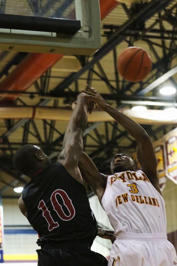 Loyola junior guard Johnny Griffin Jr. loses a rebound to William Carey senior forward Cory Jackson in the second half of their game against William Carey University in the Den Jan 23, 2016. The men lost 71-83 to SSAC rival William Carey, who ranks first in the conference.