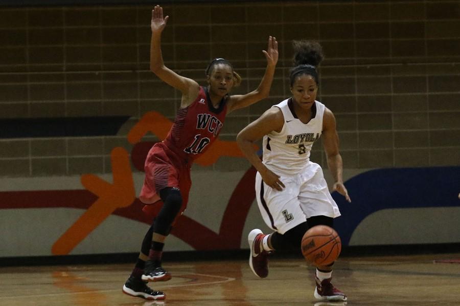 Loyola redshirt sophomore guard Dimond Jackson steals the ball from William Carey University junior guard Alyson Johnson in their game in the Den on Jan 23, 2016. The women defeated William Carey, their SSAC rival, 71-62, increasing their win streak to 8 games and their overall record to 15-3.