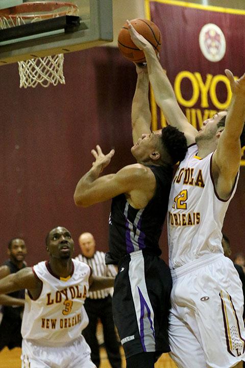 Loyola forward Nate Pierre blocks a lay up by Brandon Ingleton in the second half of their game in the Den on Jan 4, 2016. Middle GA beat Loyola in a close game 87-80, giving Loyola their third consecutive loss.