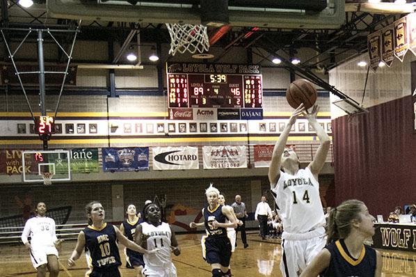 Loyola freshman guard Menley Long makes a layup on a fast break against Blue Mountain College in the Den. The women won 95-57.