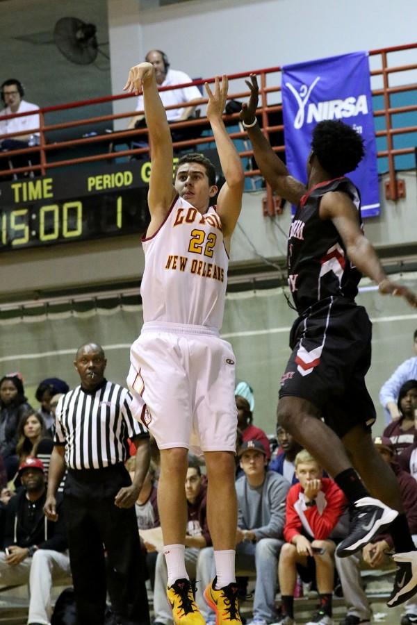 Loyola freshman guard/forward Ryan smith shoots a three point shot from the corner in the first half of their game against William Carey University in the Den Jan 23, 2016. The men lost 71-83 to SSAC rival William Carey, who ranks first in the conference.