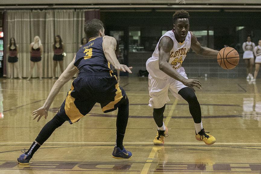Loyola freshman guard TreVon Jasmine drives to the lane against Blue Mountain College in the Den. Jasmine scored 19 points in a 54-46 victory.
