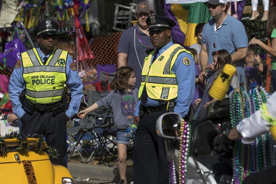 Officers Carroll, left, and Moore-Hazelett, right, stand on duty during the Krewe of Carrollton.