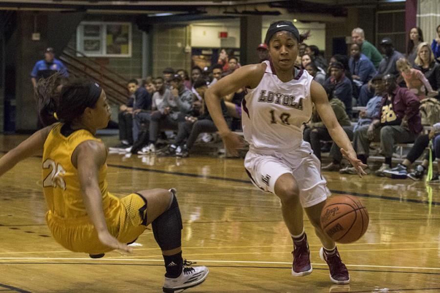 Zoie Miller, Loyola sophomore guard, blows past Whitney Gathright, Xavier senior guard, in the second quarter of their game in the Den. The women defeated Xavier University 67-57 in their final home game of the 2016 season.