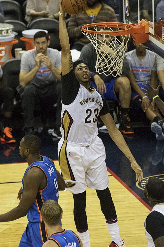 Anthony Davis dunks the ball against the Oklahoma City Thunder on Feb. 25. Davis is averaging 24 points while the Pelicans have a 23-35 record on the season. Photo credit: Zach Brien