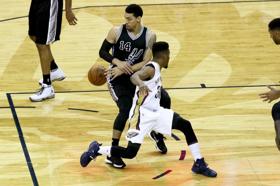 Pelicans guard Norris Cole has the ball stolen by Spurs guard Danny Green as he drives to the basket in the first half. The Pelicans lost to the Spurs 86-94.