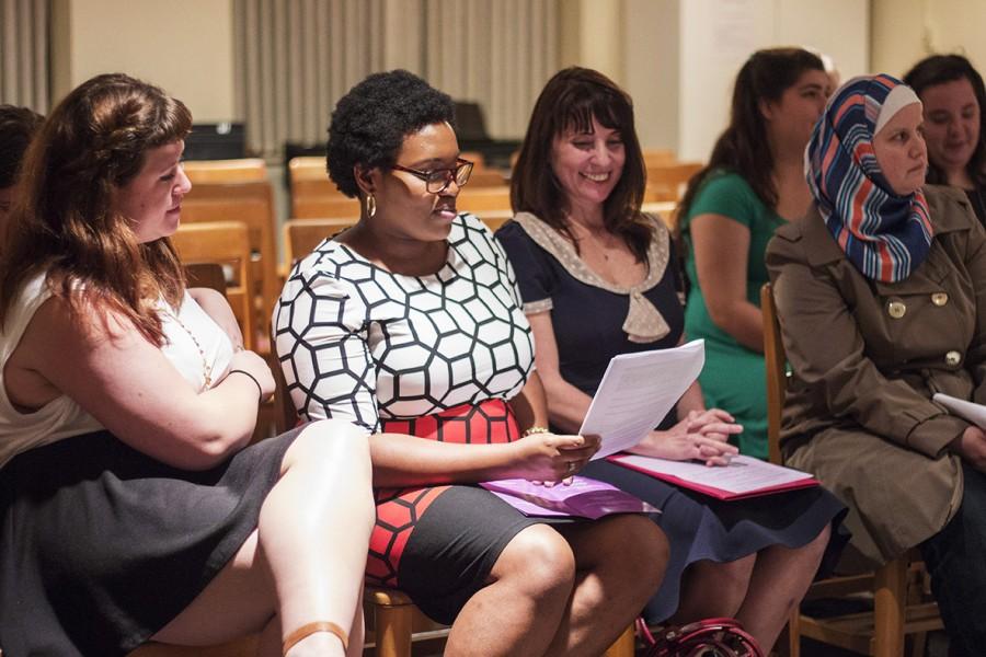Lauren Poiroux, sociology senior, A’niya Robinson, political science senior, and Patricia Boyett, director of the Women’s Resource Center,  read along at the Interfaith Prayer Vigil on Tuesday March 8, 2016. The prayer vigil was a part of the Feminist Festival put on by the Women’s Resource Center. Photo credit: Taylor Galmiche