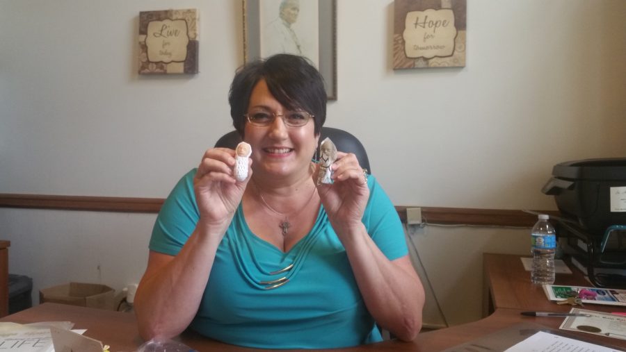 Anders holds up the “precious ones” figurines. Anders said she knows the stereotypes and stigmas Catholics get through being pro-life advocates and wants to try a different approach to advocacy. She and the St. Anthony of Padua Church provide for the spiritual adoption program, first initiated in 1991, for the New Orleans area.