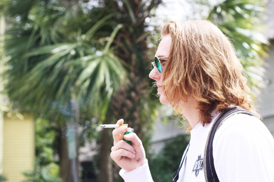Leo Kwiatkowski, music industry business sophomore, smokes off campus. The smoking ban’s grace period ended in February 2016, after the smoking ban went into effect in August 2015. 