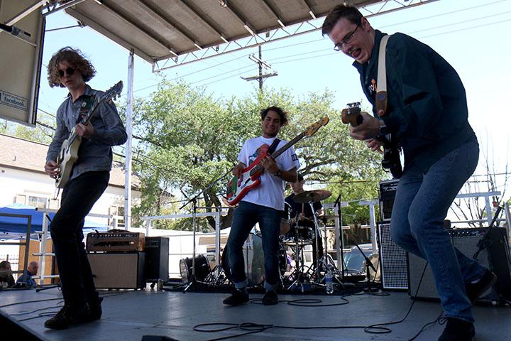 Spence Bailey, left, music industry junior, Kendrick Magallanes, center, music industry junior, and Dylan Kidd, right, music industry junior, jam with Elysian Feel on the Loyola University stage at the 2016 Freret Street Festival. Elysian Feel was one of several bands featuring Loyola alumni or current students.