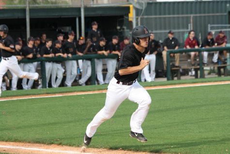 Sophomore Spencer Rosenbohm sprints to first base after hitting a single against William Carey on Friday, April 29. 