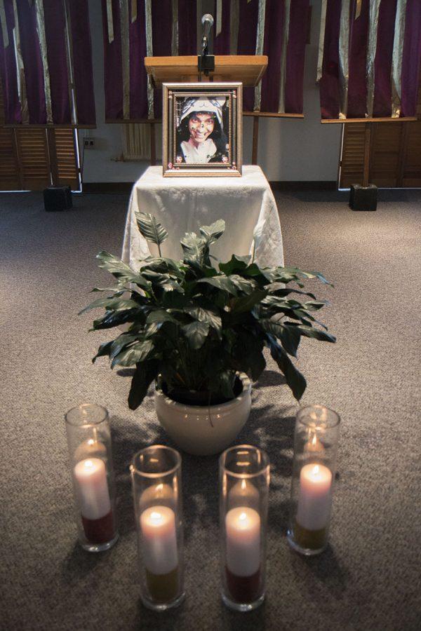 A picture of Juliano Mastroianni, an international business sophomore, was placed at the podium, behind four candles dedicated to the students and faculty members who died this semester, during the memorial for Mastroianni in Ignatius Chapel. Mastroianni was found dead in his Cabra Hall dorm room on April 14.