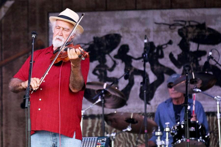 Michael Doucet plays his violin at the Fais Do-Do stage at the 2015 New Orleans Jazz and Heritage Festival.