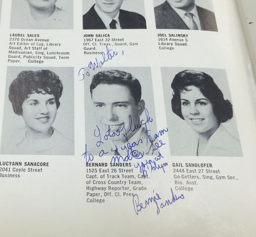 Nick Reimann/The Maroon

Walter Block shows his yearbook from James Madison High School in 1959. Pictured is a signature and message from his track teammate, Bernie Sanders.