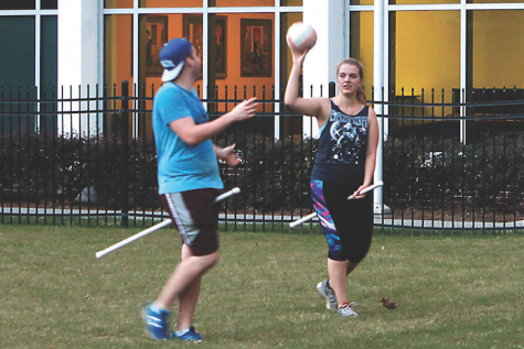 A’16  Tyler Steele, exhange student Carolin Tigges and music industry junior Peter De Armas toss a ball during quidditch practice. The Quidditch team hosted a tournament on Oct. 1 and beat the University of Southern Mississippi and Tulane. 