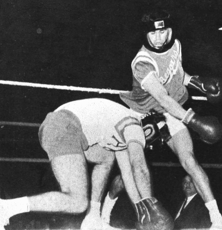 Wally Cowan, a Beggars brother, misses a right hand swipe at a fallen Curt Sins of Alpha Delta Gamma in the 1964 intramural boxing tournament between fraternities. The sororities at the time did no such thing. Photo credit: The Maroon