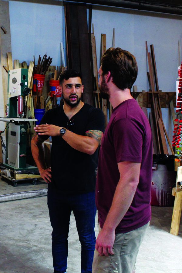 Michael Dalle Molle, left, and Jordan Gurren, right, the founders and co-owners of GoodWood NOLA, discuss layout plans for their new 4,200+ ft. studio in MidCity. Photo credit: Sean Brennan