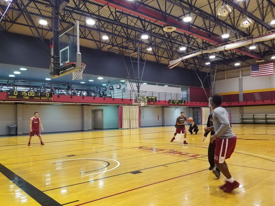 The men's basketball team practices on First NBC court.  The team is off to a strong start this season. Photo credit: Starlight Williams