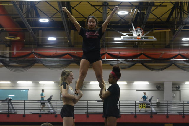 The cheer team practices a routine before their first event. The cheer team came in second at the SSAC championships. Photo credit: Davis Walden