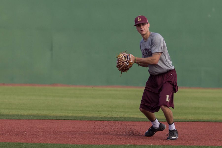 Blake+Toscano%2C+Loyola+Wolfpack+shortstop+and+business+major%2C+throws+a+baseball+during+practice%2C+at+the+John+A.+Alario+Sr.+Event+Center+baseball+diamond+in+Westwego%2C+January%2C+14.+The+senior+said+he+hopes+to+see+some+participation+from+Loyola+students+during+the+season.+Photo+credit%3A+Osama+Ayyad