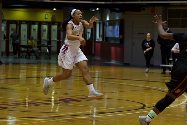 Junior guard Di'mond Jackson passes the ball during their game on Jan. 26. Jackson won the SSAC player of the week award for the second week in a row Photo credit: Marisabel Rodriguez