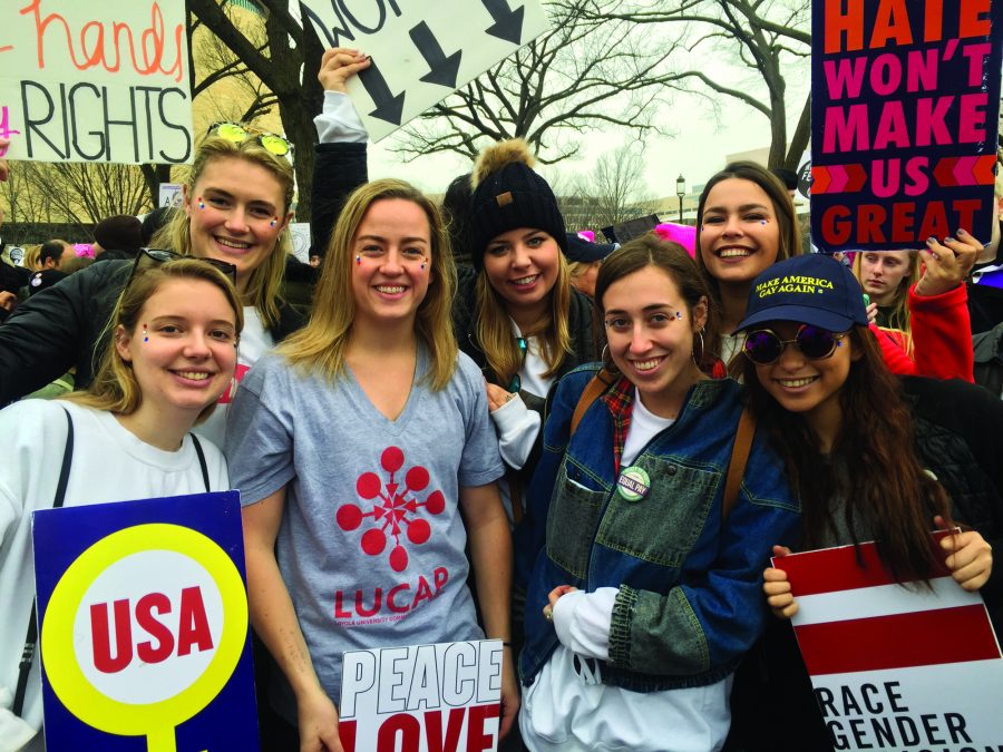Several Loyola students carpooled from New Orleans to Washington DC to participate in the Womens March on Saturday, Jan. 21. These students were some of the 500,000 protesters at the capital, the largest in its history. Kate OLeary, biology senior, points out the power and needed improvements for protest. Photo credit: Dannielle Garcia