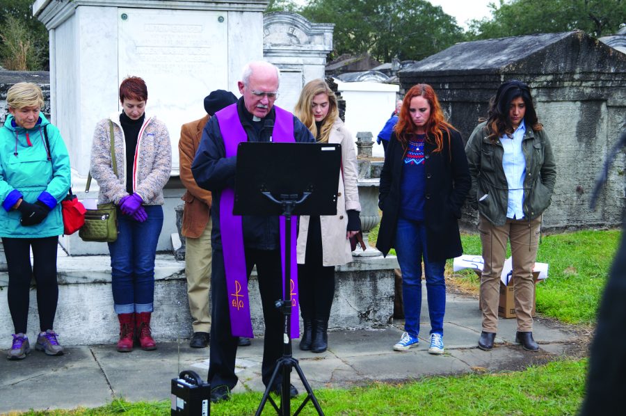 The Rev. Fred Kammer, S.J., director of the Jesuit Social Research Institute, leads a group of protestors in prayer at Lafayette Cemetery No. 1 on Jan. 28. The protest was against repealing the Affordable Care Act and Medicaid expansion in Louisiana. 