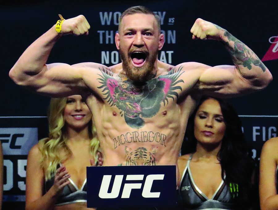 FILE+-+In+this+Friday%2C+Nov.+11%2C+2016%2C+file+photo%2C+Conor+McGregor+stands+on+a+scale+during+the+weigh-in+event+for+his+fight+against+Eddie+Alvarez+in+UFC+205+mixed+martial+arts+at+Madison+Square+Garden+in+New+York.+Floyd+Mayweather+Jr.+wants+attention+more+than+he+wants+a+fight.+And%2C+really%2C+lets+be+truthful+here.+It+wouldnt+be+much+of+a+fight+if+Mayweather+and+Conor+McGregor+met+in+a+boxing+ring.+%28AP+Photo%2FJulio+Cortez%2C+File%29