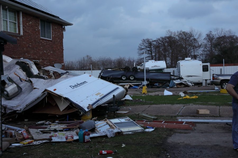 Residents of Parc DOrleans assess the aftermath of an EF2 tornado in East New Orleans, Louisiana, Feb. 7, 2017. Residents cooperated to evacuate injured community members and disconnected propane lines as a precationary measure. Photo credit: Osama Ayyad