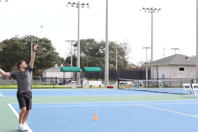Anthony+Zaleski%2C+biology+junior+practices+his+serve+in+City+Park.+The+spring+season+starts+on+Jan.+27+against+Mississippi+Gulf+Coast+Community+College+at+City+Park+Tennis+Center.+Photo+credit%3A+Alliciyia+George