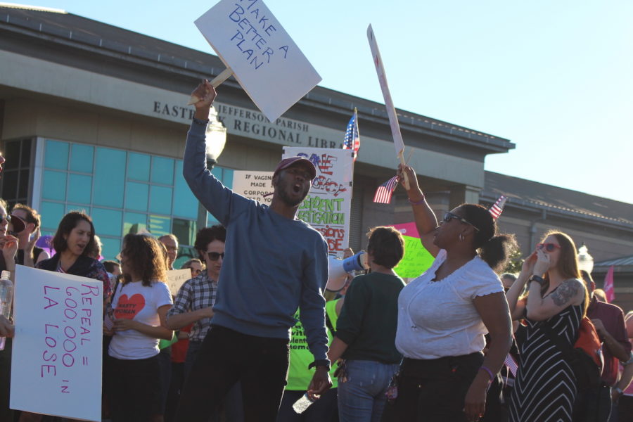 Charles Eden and Jumal Otis play off of each other with chants as they wait for Sen. Bill Cassidy to leave the town hall meeting. Several dozen people gathered around Jefferson Parish Library to give their testimonials in protest to Sen. Bill Cassidys town hall on Feb. 23, 2017. 