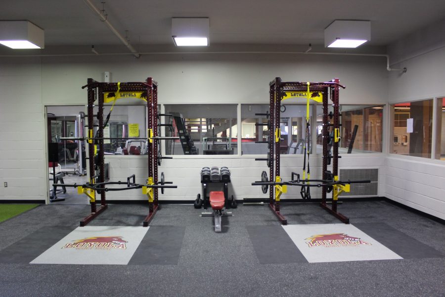 Loyola+weight+room+users+hit+the+gym+heavy+with+new+advanced+squat+machines+and+other+safer%2C+much+improved+equipment.+The+renovations+began+at+the+end+of+last+semester+and+were+expected+to+be+complete+by+Feb.+7%2C+but+the+athletic+department+officially+re-opened+its+doors+to+all+the+sweat+seekers+a+week+behind+schedule.+Photo+credit%3A+Tristan+Emmons