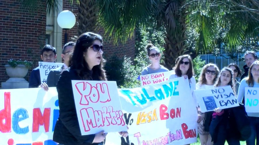 Students, faculty and staff denounce President Trump's executive order travel ban at an Academics United demonstration at Tulane University. An immigrant from Pakistan spoke to demonstrators about issues she faces as an immigrant in the U.S. Photo credit: Alliciyia George