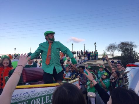 A rider throws beads from a float to crowds near Jackson Square in the French Quarter at the St. Patrick's Day parade March 17. Photo credit: Erin Snodgrass
