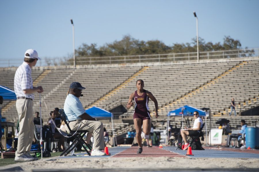 Leah Banks, mass communication sophomore, races toward the sand during the long jump competition at the Tulane Twilight Invitational on March 4, 2016. Banks led Loyola in different categories for the womens team. Photo credit: Courtesy of Loyola Athletics